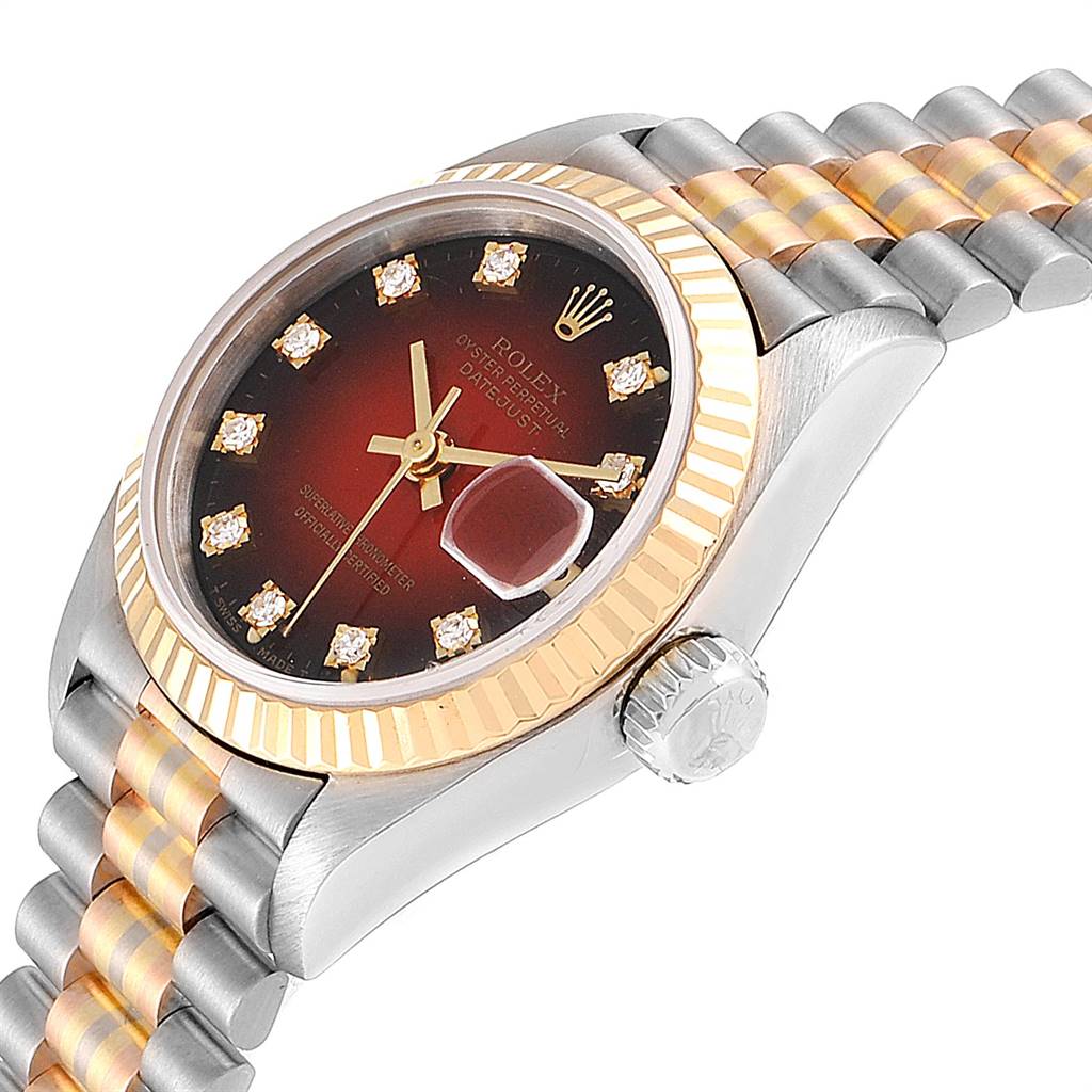 The Rolex President 69179 Women's White Gold Red Dial 69179 Women's White Gold Red Dial model watch is shown at an angle displaying the face, fluted bezel, crown, and part of the bracelet.
