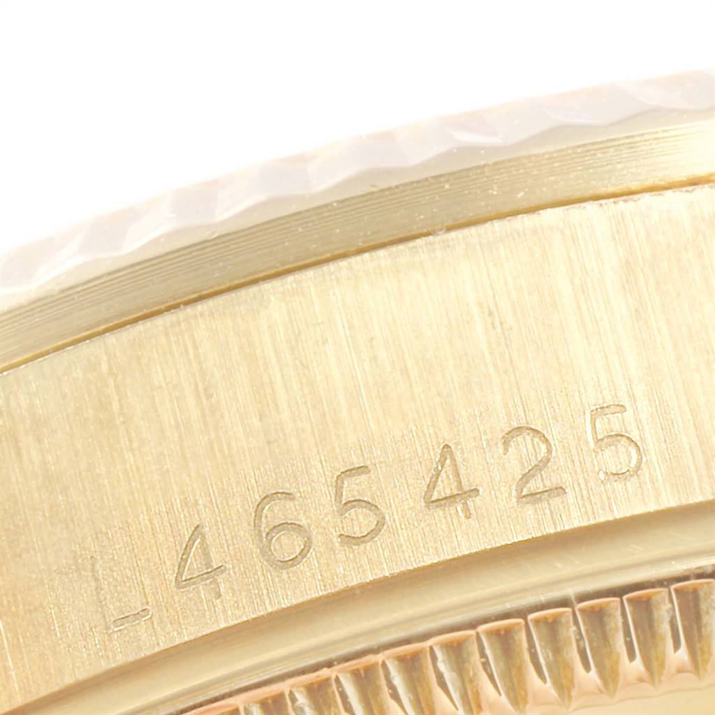 This close-up image shows the serial number and part of the bezel of the Rolex President 68278 Women
s Yellow Gold Champagne Dial 68278 Women
s Yellow Gold Champagne Dial model.