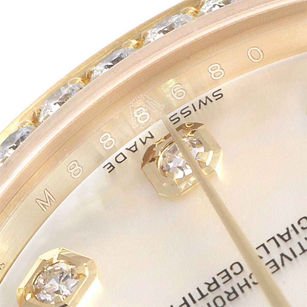 This close-up angle of the Rolex President 178158 Women
s Yellow Gold Mother of Pearl Dial 178158 Women
s Yellow Gold Mother of Pearl Dial model watch shows parts of the dial, bezel, and diamond accents.