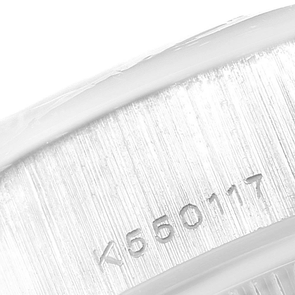 This image shows a close-up of a serial number engraved on the side of a Rolex President 79136 Women's Platinum Mother of Pearl Dial 79136 Women's Platinum Mother of Pearl Dial model watch.