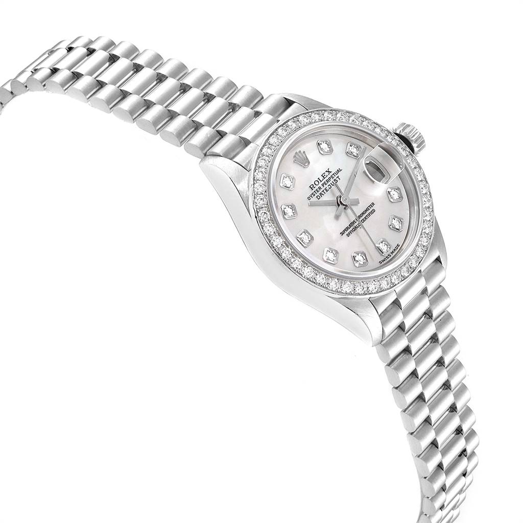 The image shows a side angle of a Rolex President 79136 Women's Platinum Mother of Pearl Dial 79136 Women's Platinum Mother of Pearl Dial model watch, displaying its bracelet, bezel, and dial with diamond markers.