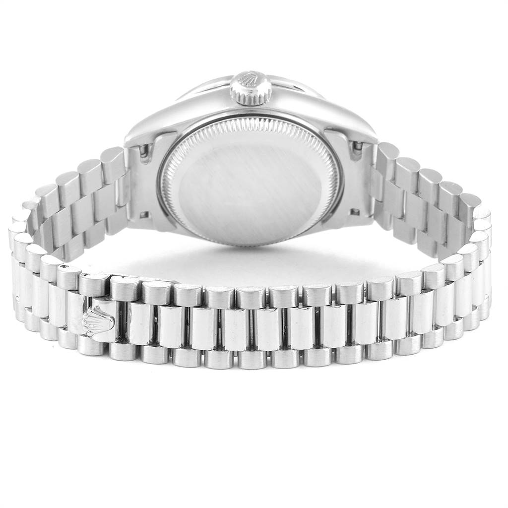 The image shows the back view of a Rolex President 79136 Women's Platinum Mother of Pearl Dial 79136 Women's Platinum Mother of Pearl Dial model watch, focusing on the case back and bracelet.