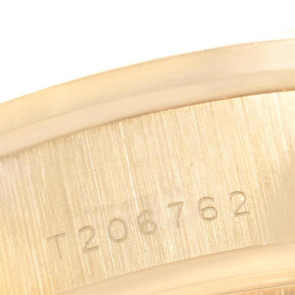 This close-up image shows the engraved serial number on the side of a Rolex President 69178 Women
s Yellow Gold Champagne Dial 69178 Women
s Yellow Gold Champagne Dial watch case.