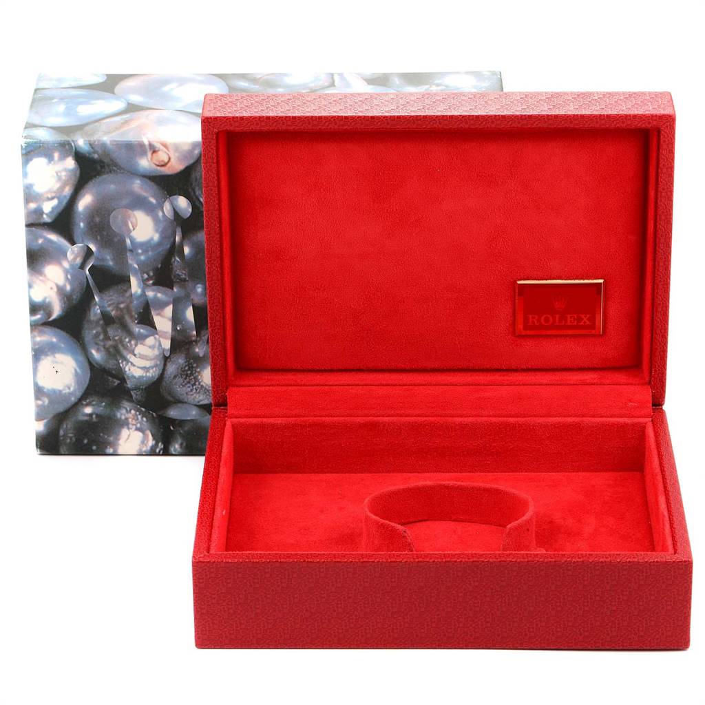 This image shows the open watch box for a Rolex President 69178 Women
s Yellow Gold Champagne Dial 69178 Women
s Yellow Gold Champagne Dial model, revealing its red interior and space for the watch.