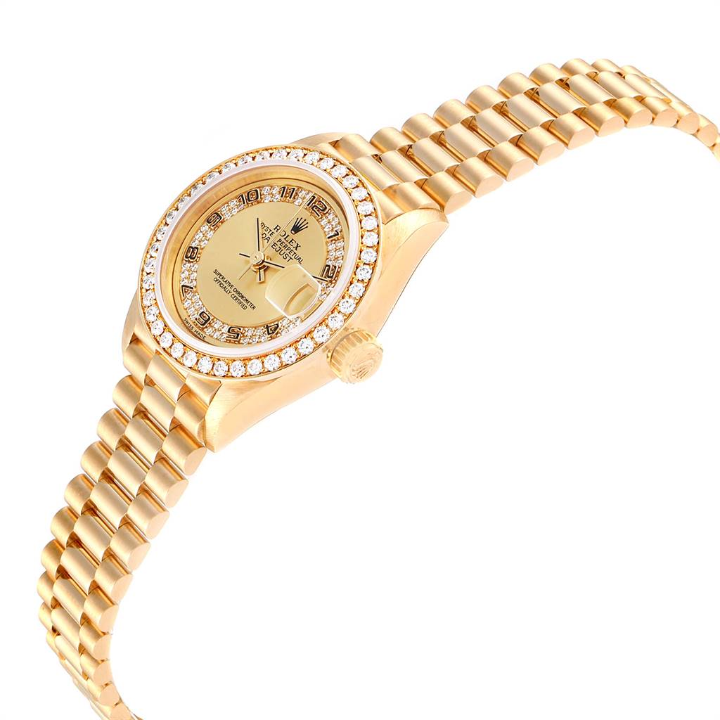 The image shows a side-angle view of a Rolex President 69178 Women
s Yellow Gold Champagne Dial 69178 Women
s Yellow Gold Champagne Dial model watch, highlighting the dial, bracelet, crown, and diamond bezel.