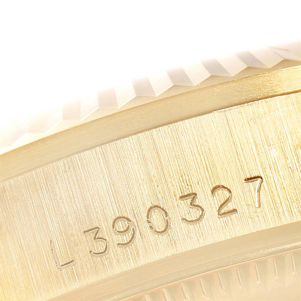The image shows a close-up of the engraved serial number on the case of a Rolex President 68278 Women
s Yellow Gold Champagne Dial 68278 Women
s Yellow Gold Champagne Dial model watch.