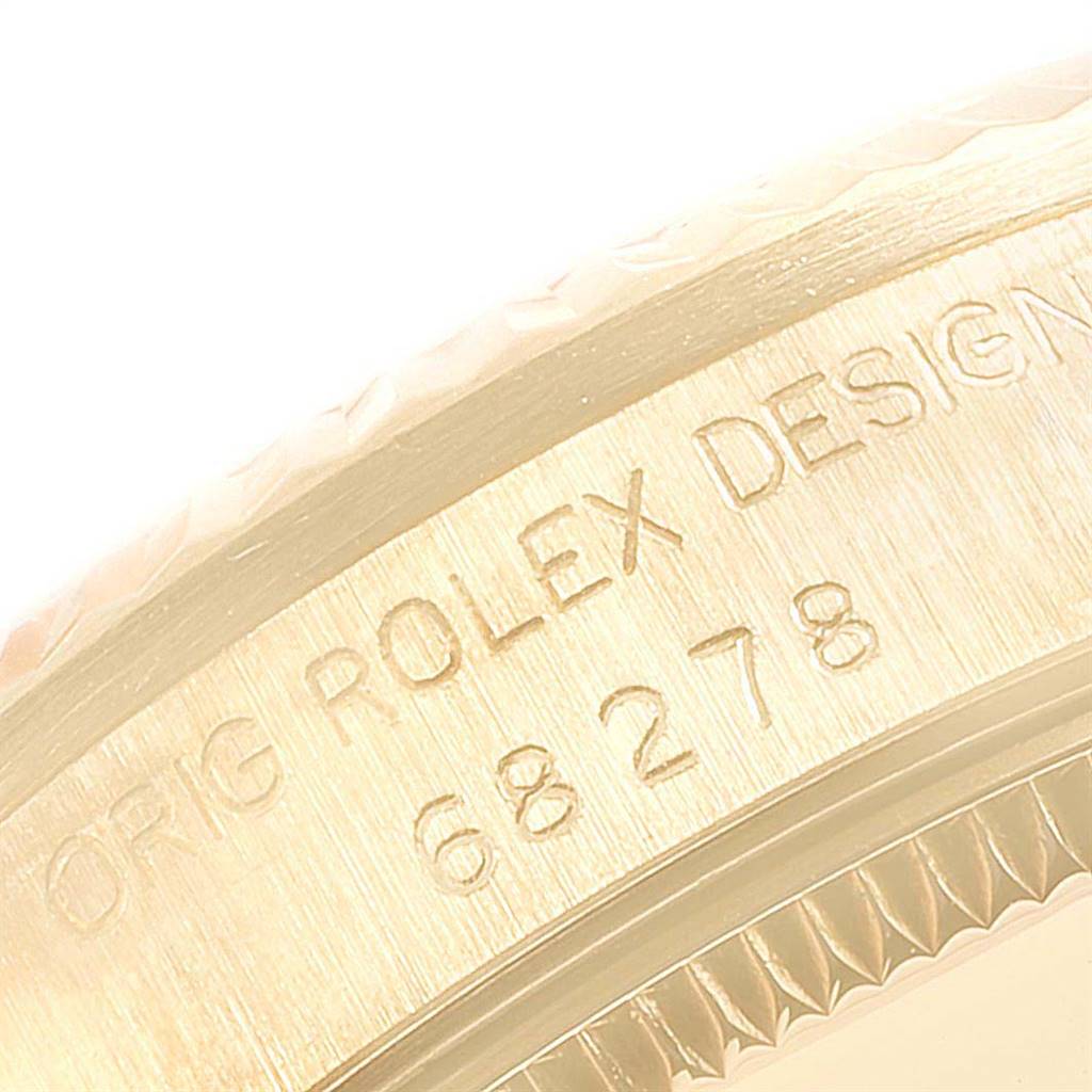 This image shows a close-up of the inscription on the case of a Rolex President 68278 Women
s Yellow Gold Champagne Dial 68278 Women
s Yellow Gold Champagne Dial model watch.