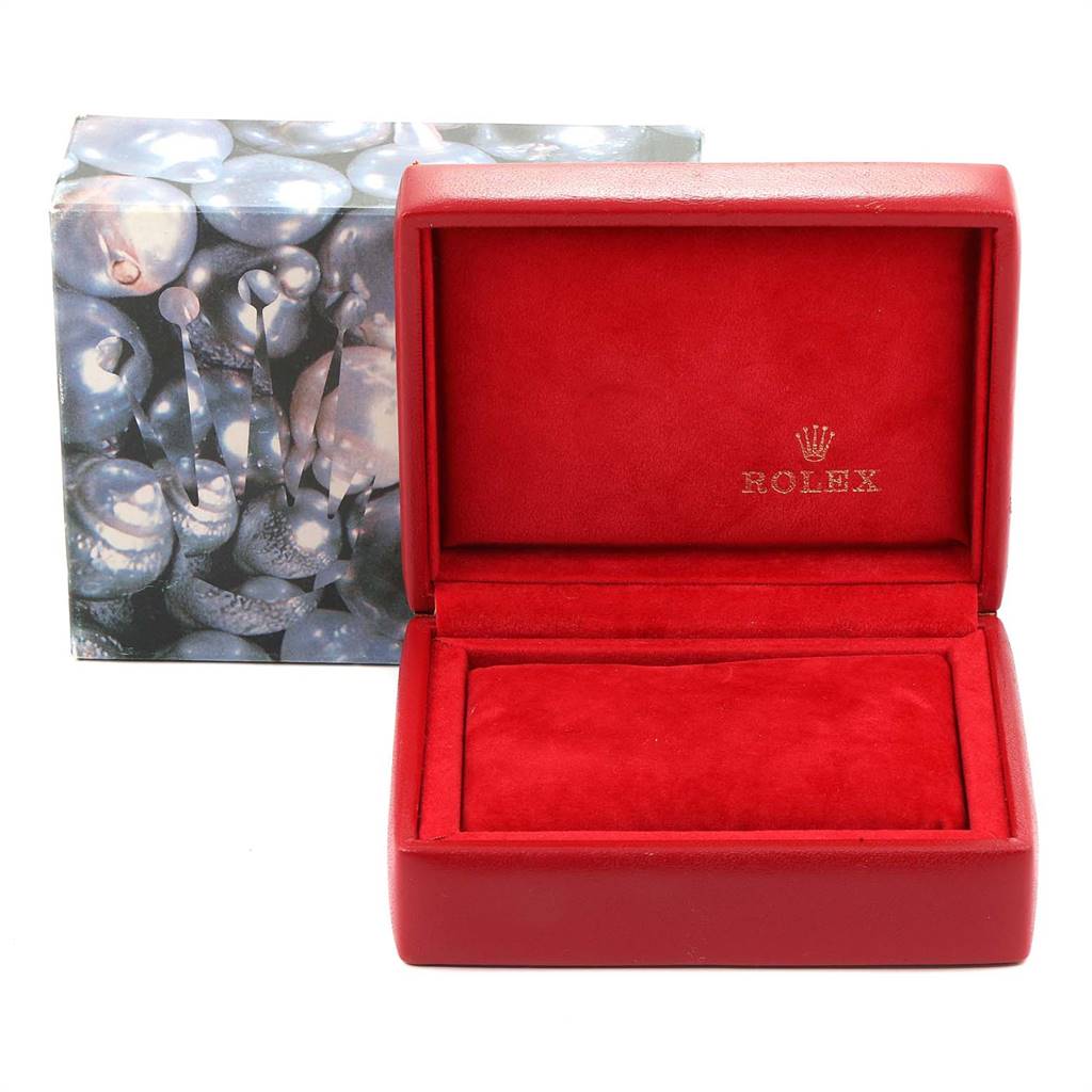 The image shows a red Rolex watch box for the President model, with an outer decorative box in the background.
