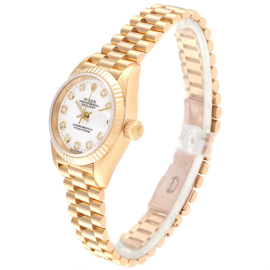 The image shows a side angle of a Rolex President 69138 Women
s Yellow Gold White Dial 69138 Women
s Yellow Gold White Dial model watch, highlighting its gold bracelet, case, and face with diamond hour markers.