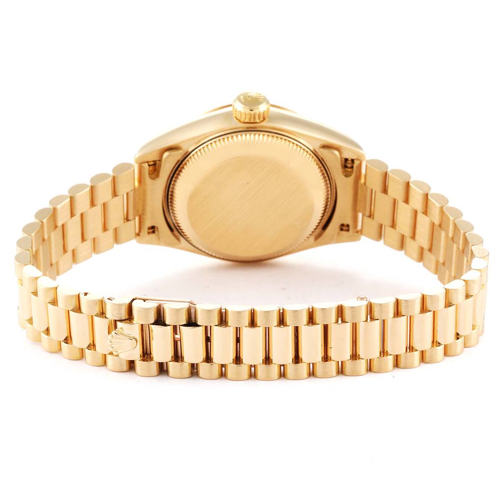 The image shows the back and bracelet of a gold Rolex President 69138 Women
s Yellow Gold White Dial 69138 Women
s Yellow Gold White Dial model watch.