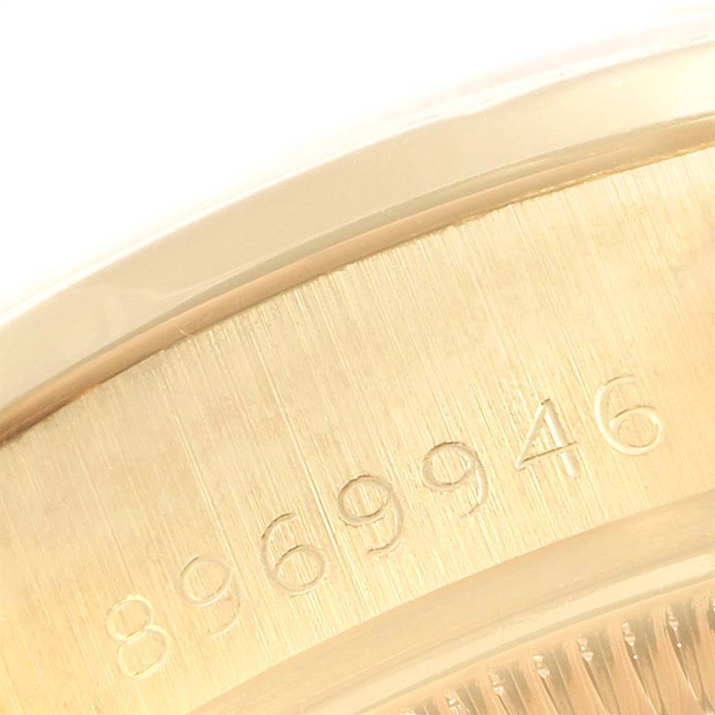 A close-up angle of the Rolex President 69138 Women's Yellow Gold Silver Dial 69138 Women's Yellow Gold Silver Dial model showcasing the serial number engraved on the watch's exterior.