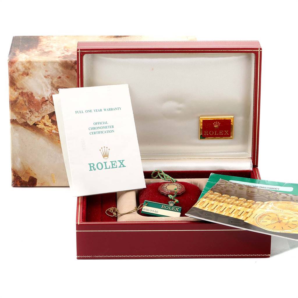 The image shows an open Rolex President 69138 Women's Yellow Gold Silver Dial 69138 Women's Yellow Gold Silver Dial watch box with warranty papers, a tag, and a booklet inside.
