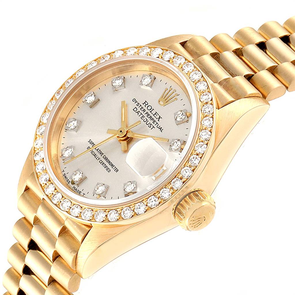 The image shows a close-up angled view of the Rolex President 69138 Women's Yellow Gold Silver Dial 69138 Women's Yellow Gold Silver Dial model watch, featuring the dial, bezel, crown, and part of the bracelet.