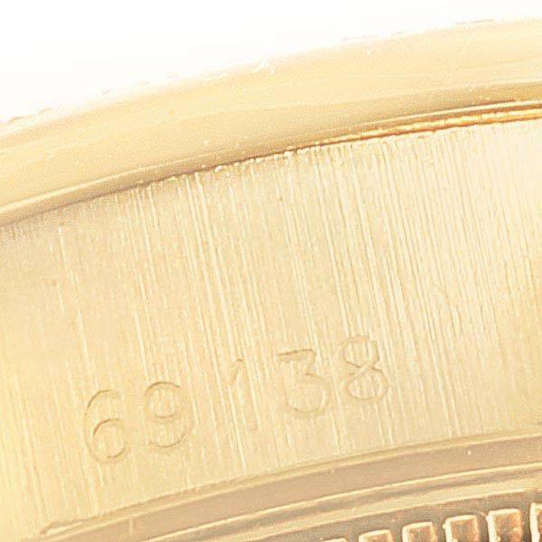 This image shows a close-up of the model number "69138" engraved on the case of a Rolex President 69138 Women's Yellow Gold Silver Dial 69138 Women's Yellow Gold Silver Dial watch.