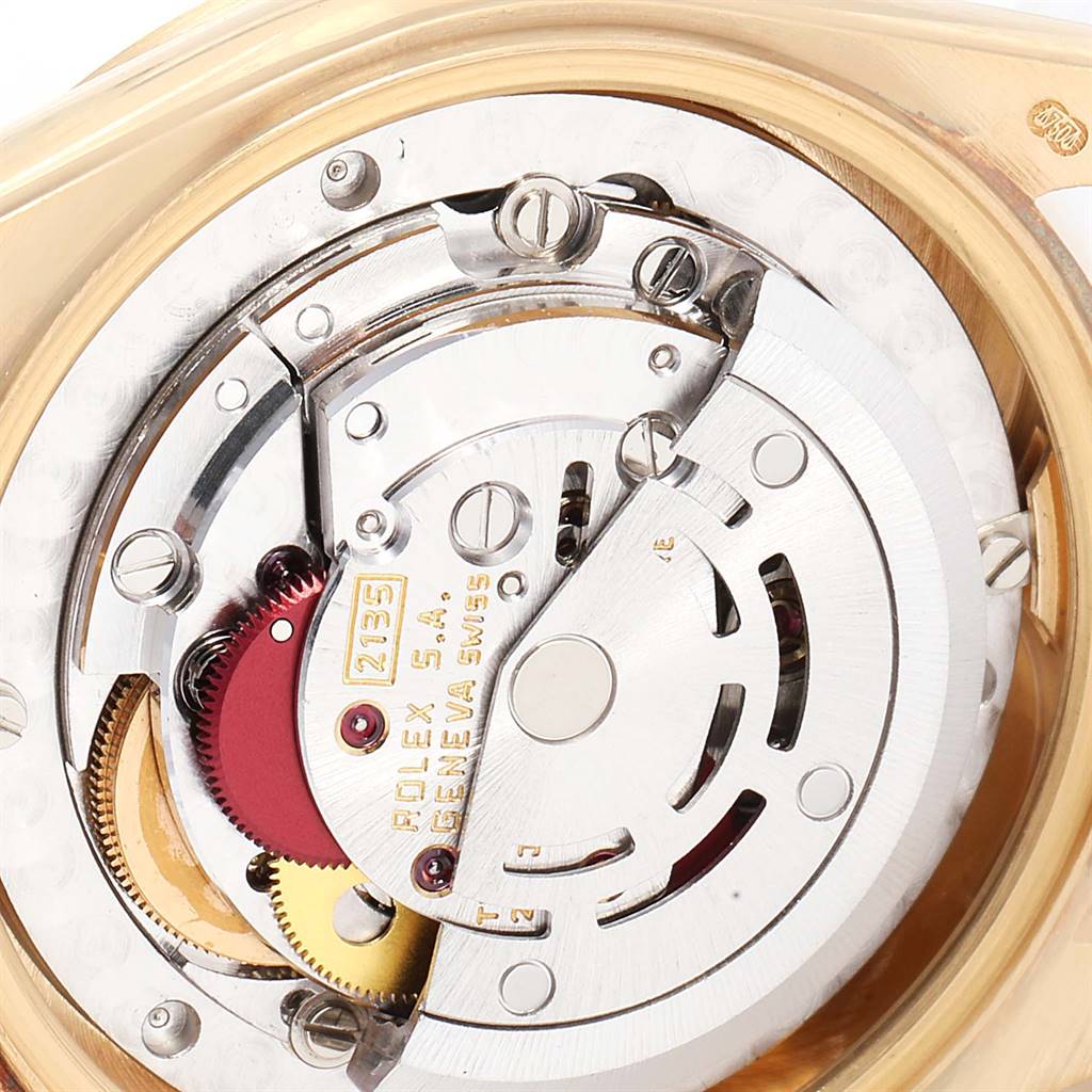 The image shows a close-up of the movement mechanism of a Rolex President 68278 Women
s Yellow Gold Champagne Dial 68278 Women
s Yellow Gold Champagne Dial model watch.