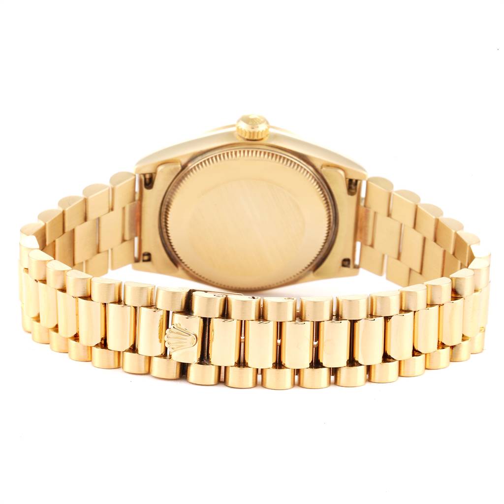 The Rolex President 68278 Women
s Yellow Gold Champagne Dial 68278 Women
s Yellow Gold Champagne Dial model is shown from the back angle, highlighting its case back, crown, and gold President bracelet.