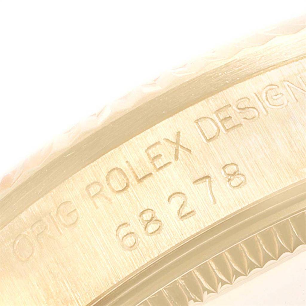 The image shows a close-up of the engraved outer edge of the case back of a Rolex President 68278 Women
s Yellow Gold Champagne Dial 68278 Women
s Yellow Gold Champagne Dial model.