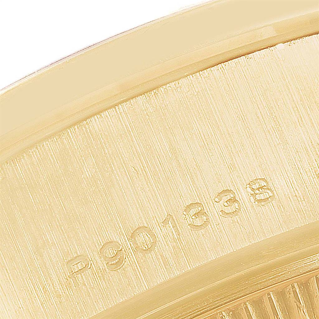 Close-up of the serial number on the gold back casing of a Rolex President 79158 Women
s Yellow Gold Champagne Dial 79158 Women
s Yellow Gold Champagne Dial model watch.