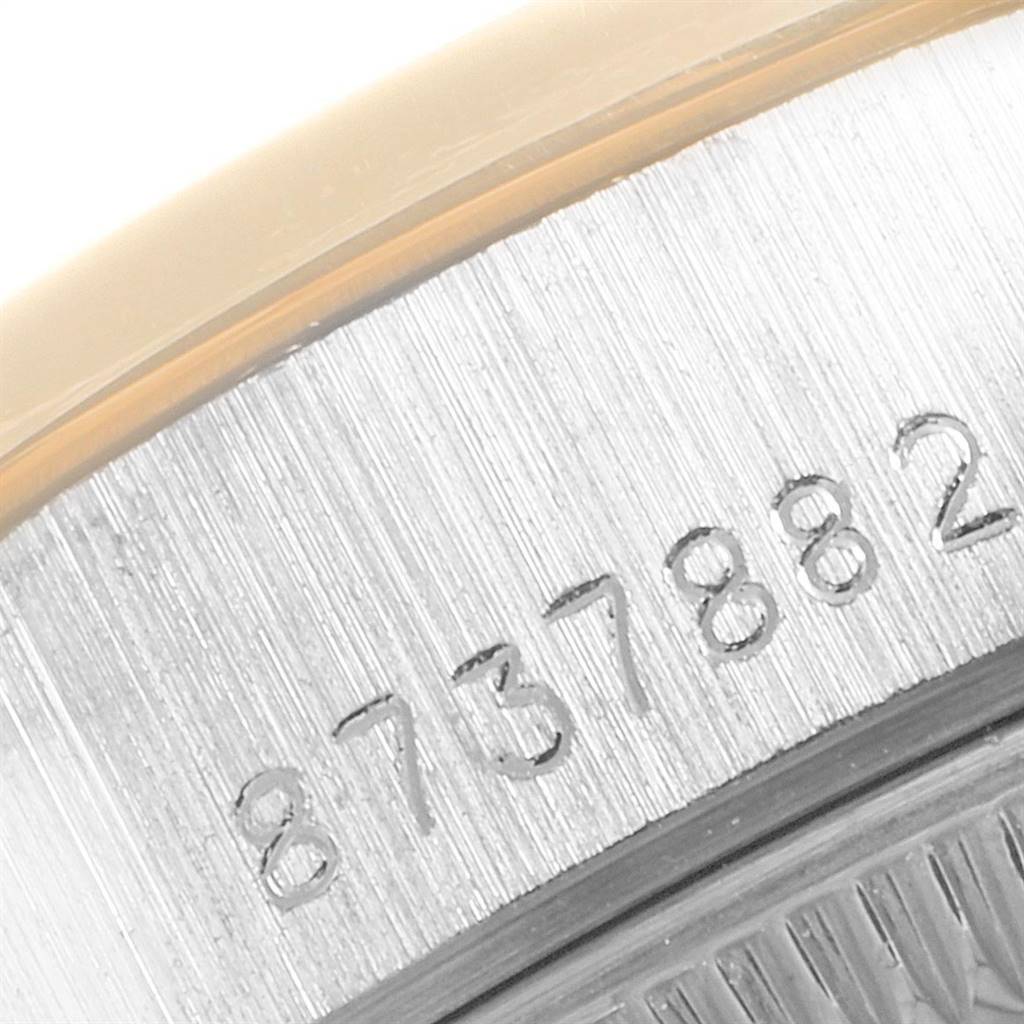 This image shows a close-up of the serial number engraved on the case of a Rolex President 69149 Women's White Gold Brown Dial 69149 Women's White Gold Brown Dial model watch.