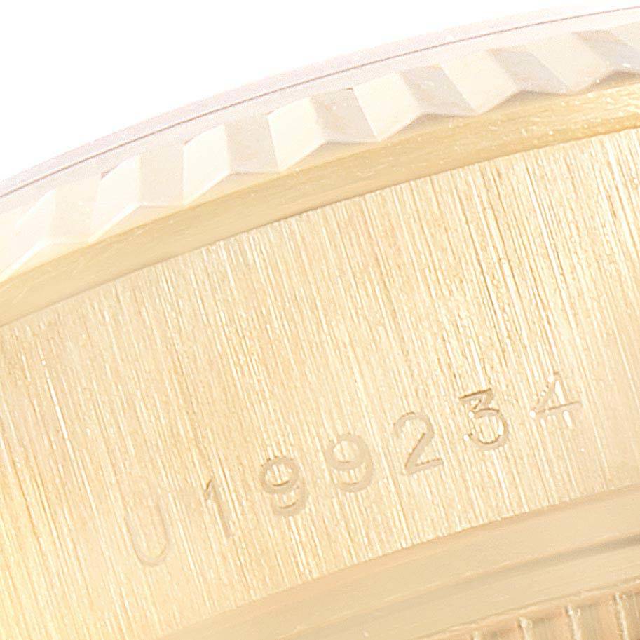 The image shows a close-up of the case side and fluted bezel of a Rolex President 79178 Women's Yellow Gold Black Dial 79178 Women's Yellow Gold Black Dial model, with part of the serial number visible.