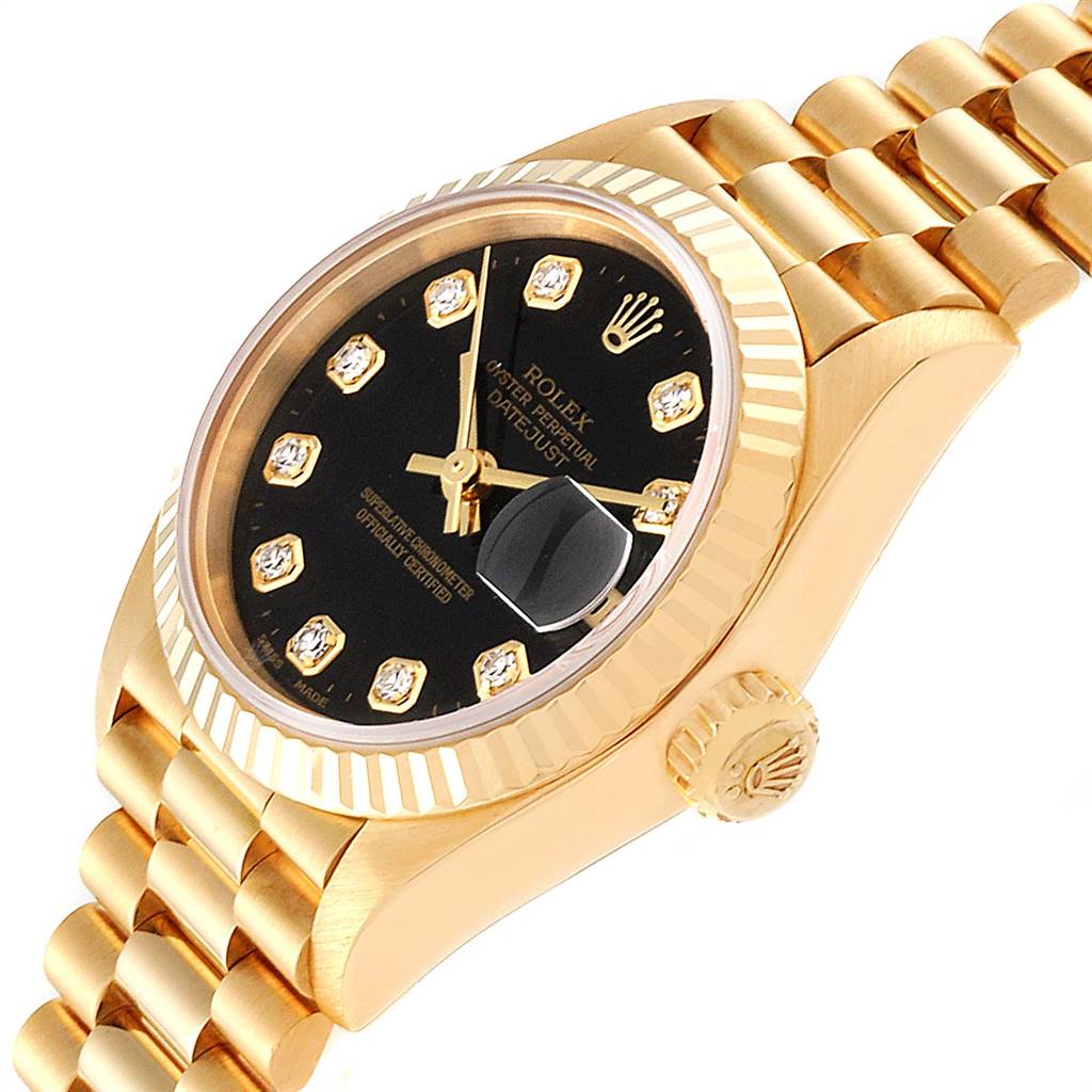 This image shows a side angle view of a Rolex President 79178 Women's Yellow Gold Black Dial 79178 Women's Yellow Gold Black Dial model watch, highlighting its black dial, fluted bezel, and gold bracelet.