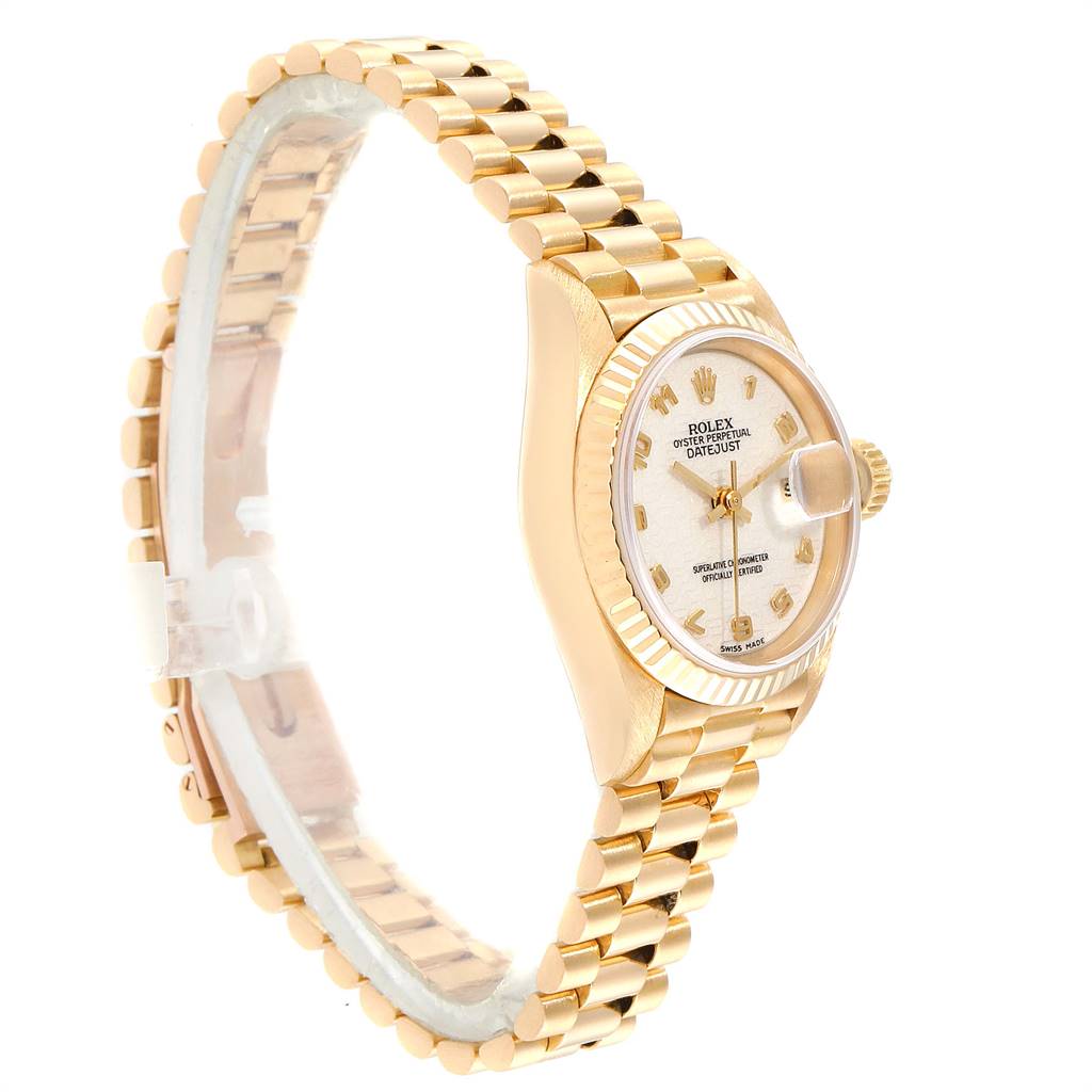 This image shows a side angle of a Rolex President 69178 Women's Yellow Gold Beige Dial 69178 Women's Yellow Gold Beige Dial model watch, highlighting the bezel, face, and bracelet.
