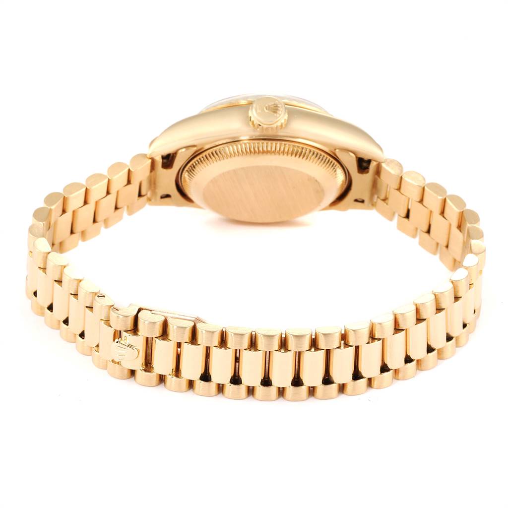 The image shows the rear view of a Rolex President 69178 Women's Yellow Gold Beige Dial 69178 Women's Yellow Gold Beige Dial model watch, highlighting the bracelet and case back.