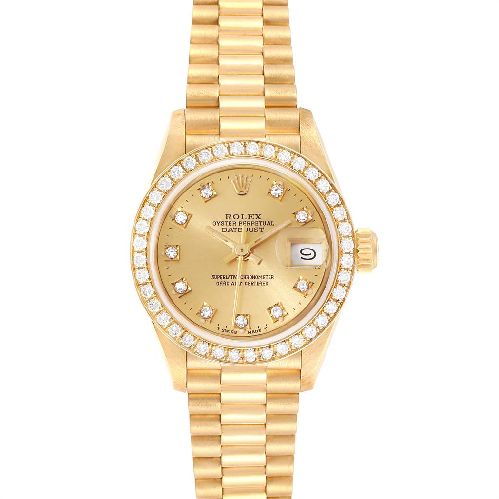 The image shows a Rolex President 69138 Women
s Yellow Gold Champagne Dial 69138 Women
s Yellow Gold Champagne Dial Datejust watch from a top view, highlighting its gold bracelet, diamond-set bezel, and yellow dial.