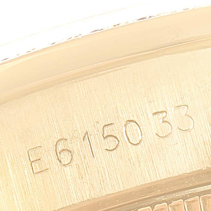 This close-up image shows the engraved serial number on the Rolex President 69138 Women
s Yellow Gold Champagne Dial 69138 Women
s Yellow Gold Champagne Dial model watch case.