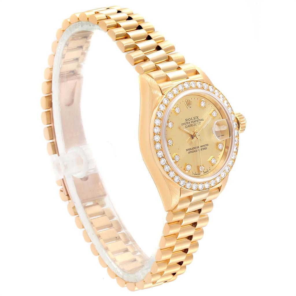 This image shows a side angle of a Rolex President 69138 Women
s Yellow Gold Champagne Dial 69138 Women
s Yellow Gold Champagne Dial model watch, featuring its gold band, diamond bezel, and face.
