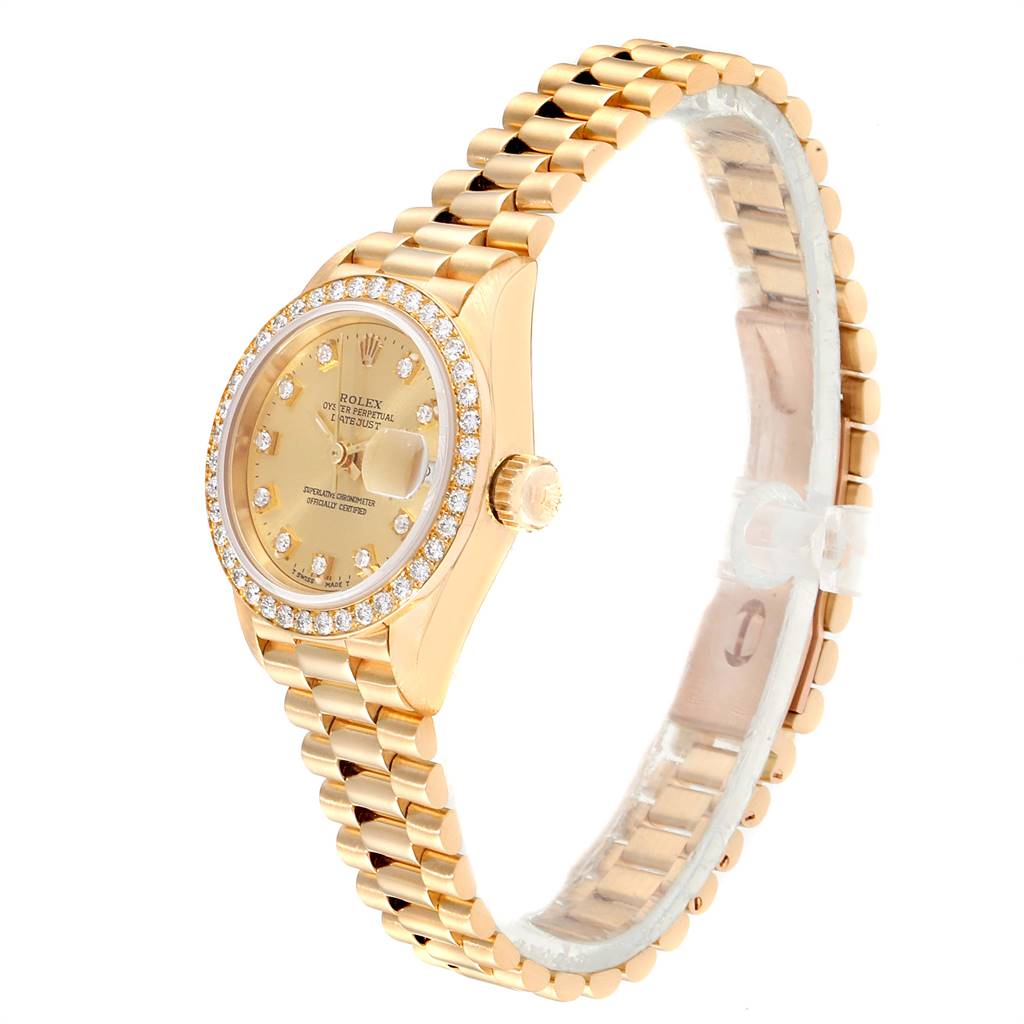 The Rolex President 69138 Women
s Yellow Gold Champagne Dial 69138 Women
s Yellow Gold Champagne Dial model watch is shown at an angle displaying the face, crown, and part of the bracelet.