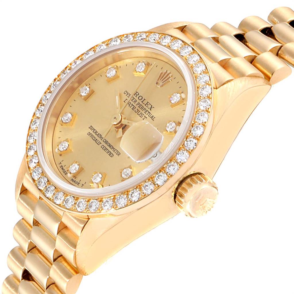 This image shows the watch face, crown, bezel, and part of the bracelet of a Rolex President 69138 Women
s Yellow Gold Champagne Dial 69138 Women
s Yellow Gold Champagne Dial model.
