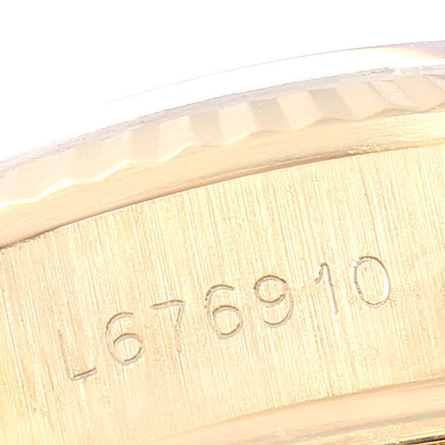 This close-up image shows the engraved serial number on the case side of a Rolex President 69178 Women's Yellow Gold Blue Dial 69178 Women's Yellow Gold Blue Dial model watch.