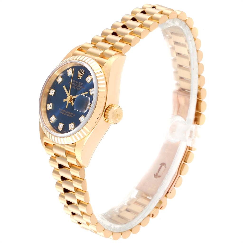 The Rolex President 69178 Women's Yellow Gold Blue Dial 69178 Women's Yellow Gold Blue Dial model watch is shown at a side angle, displaying its gold bracelet, blue dial, and crown.