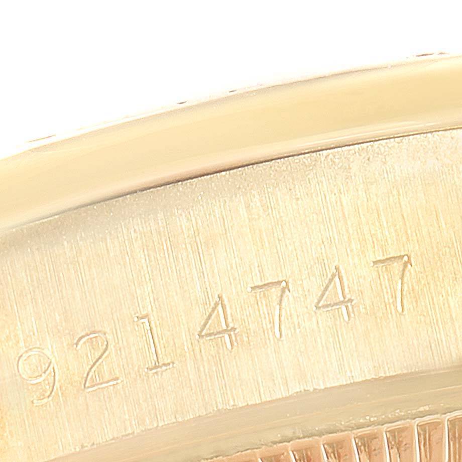 This image shows a close-up of the serial number engraving on the Rolex President 69158 Women's Yellow Gold Silver Dial 69158 Women's Yellow Gold Silver Dial model watch.