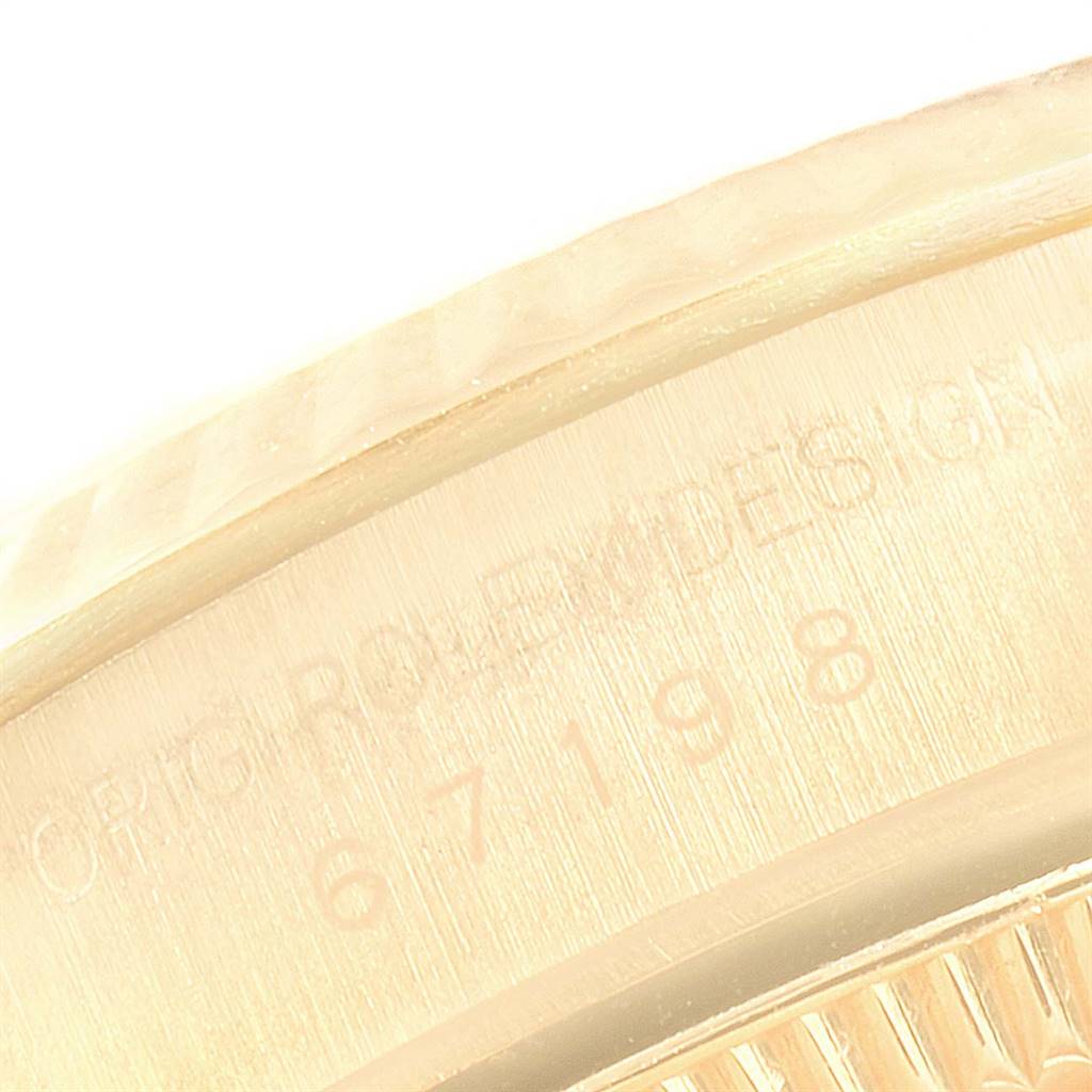 This image shows a close-up of the case edge and engraved model number of the Rolex President 67198 Women's Yellow Gold Black Dial 67198 Women's Yellow Gold Black Dial watch.