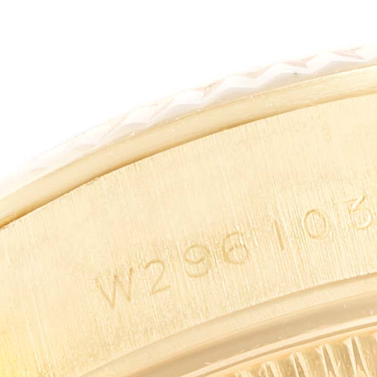 This image shows a close-up of the engravings on the side of a Rolex President 67198 Women's Yellow Gold Black Dial 67198 Women's Yellow Gold Black Dial watch case.