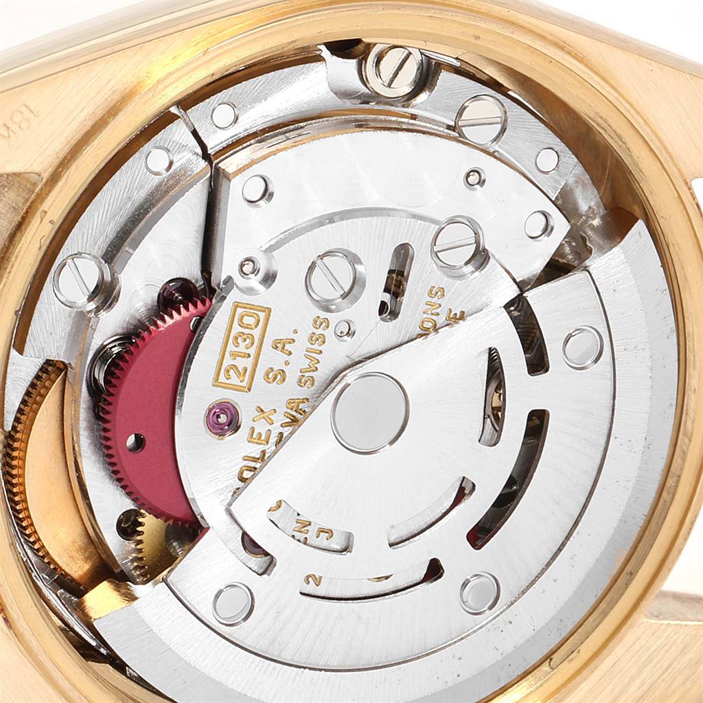 This image shows the internal mechanical movement of a Rolex President 67198 Women's Yellow Gold Black Dial 67198 Women's Yellow Gold Black Dial watch, highlighting the rotor and various gears.