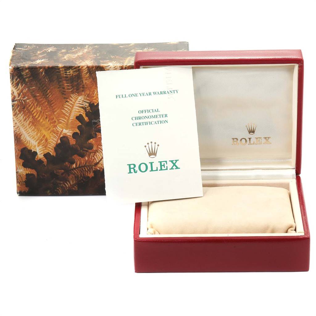 This image shows the packaging and brand booklet for a Rolex President 67198 Women's Yellow Gold Black Dial 67198 Women's Yellow Gold Black Dial model watch, including the box and official certification.