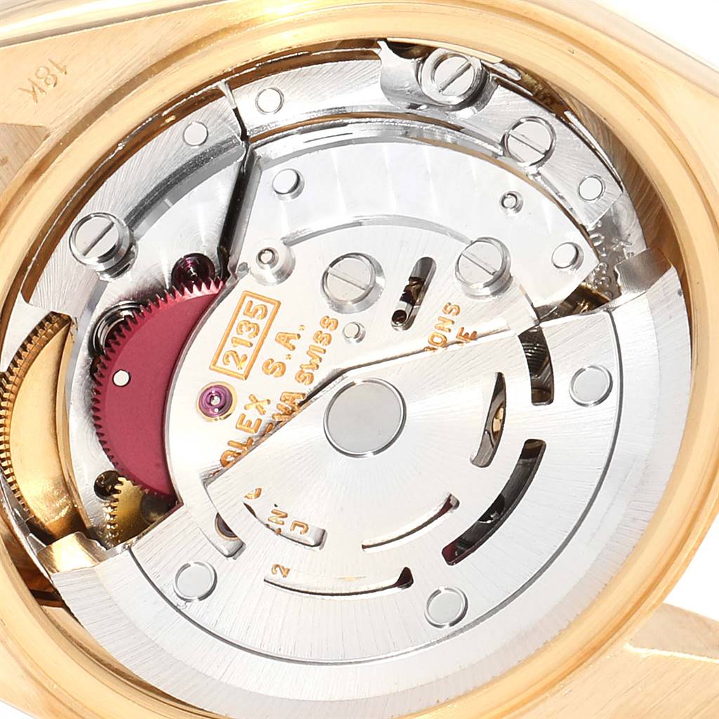 This image shows the inner mechanical movement of a Rolex President 69178 Women
s Yellow Gold Champagne Dial 69178 Women
s Yellow Gold Champagne Dial model watch, highlighting its components and engravings.