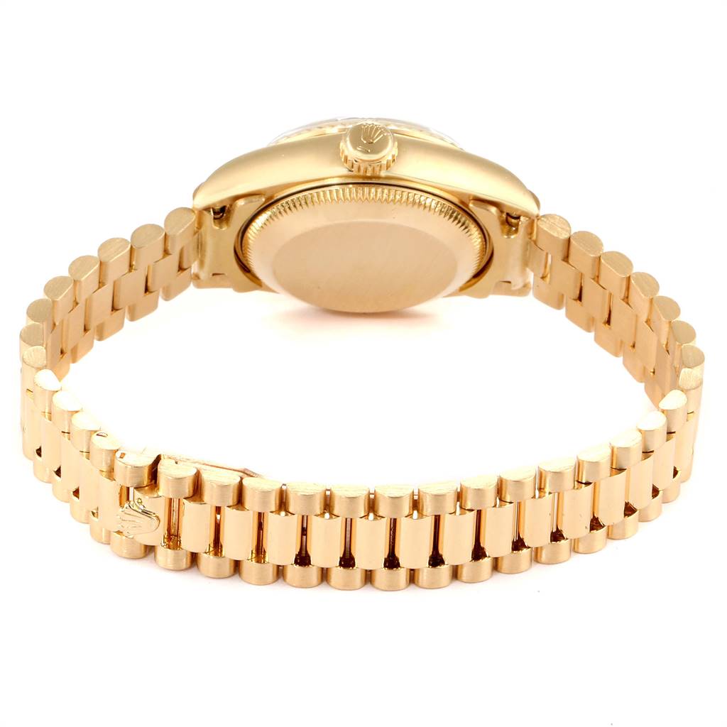 The image shows the back and bracelet of a Rolex President 69178 Women's Yellow Gold Blue Dial 69178 Women's Yellow Gold Blue Dial model watch from a horizontal angle.