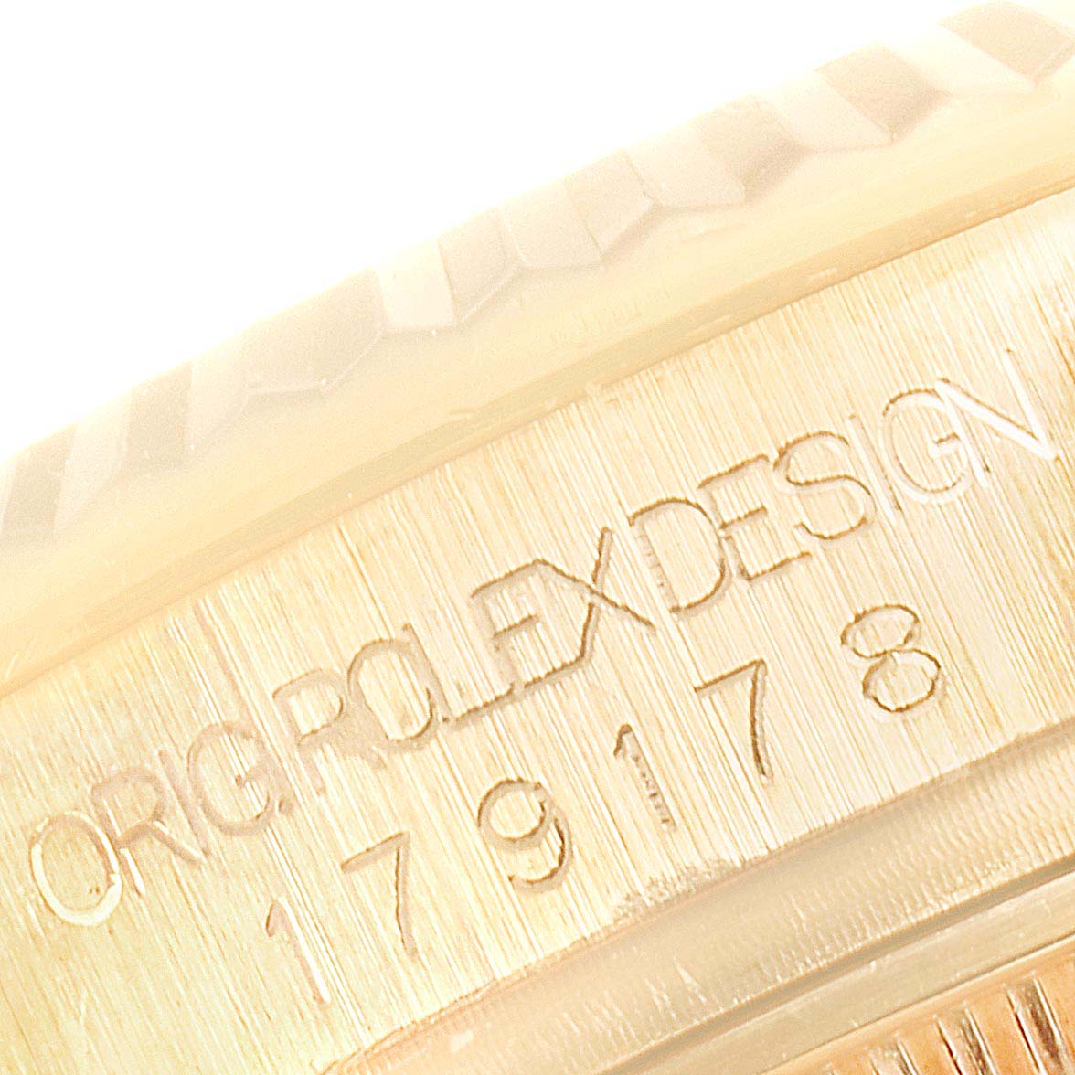 This image shows a close-up of the case side engraving of a Rolex President 179178 Women
s Yellow Gold Champagne Dial 179178 Women
s Yellow Gold Champagne Dial model watch.