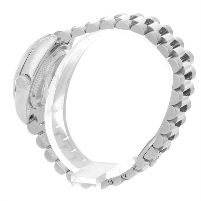 The image shows a side view of the President model Rolex watch, highlighting the bracelet and case.