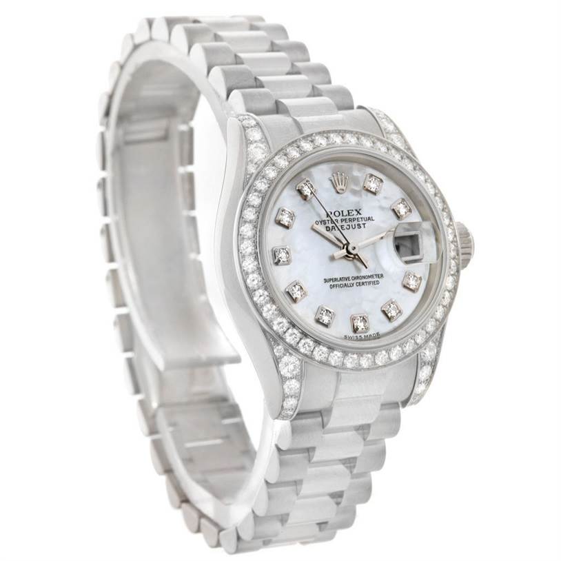 The image shows a Rolex President 179159 Women's White Gold Mother of Pearl Dial 179159 Women's White Gold Mother of Pearl Dial model watch angled to highlight its diamond-encrusted bezel and bracelet.