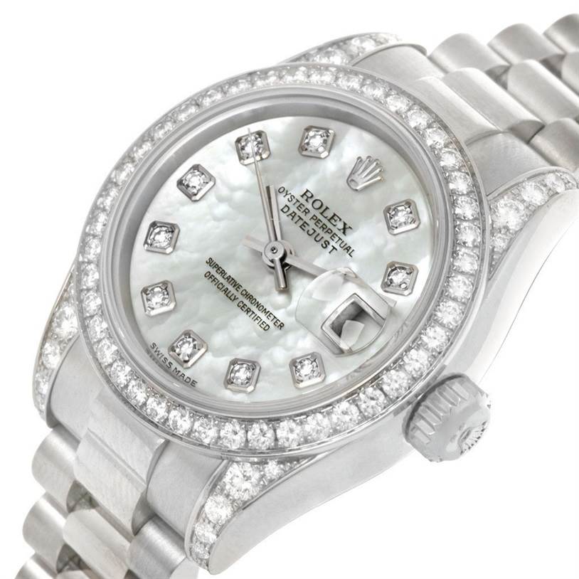 The Rolex President 179159 Women's White Gold Mother of Pearl Dial 179159 Women's White Gold Mother of Pearl Dial model watch is shown from an angled perspective, highlighting its diamond bezel, dial, and bracelet.