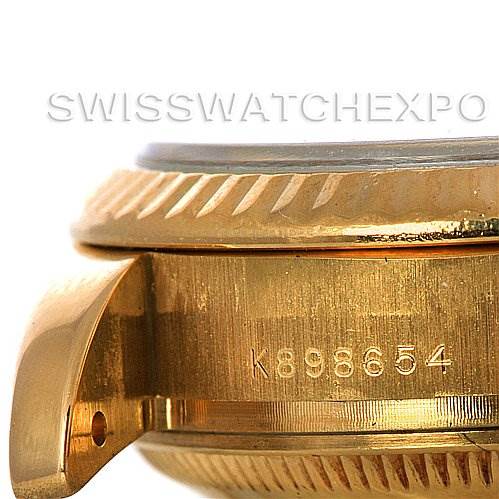 This close-up image shows the side view of a Rolex President 179178 Women's Yellow Gold White Dial 179178 Women's Yellow Gold White Dial model watch, highlighting the bezel, case, and serial number.