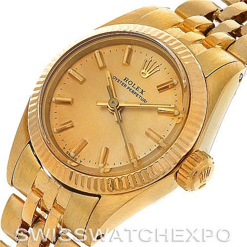 This image shows a gold Rolex President 6719 Women's Yellow Gold Champagne Dial 6719 Women's Yellow Gold Champagne Dial model watch from an angled view, highlighting the dial, crown, and part of the bracelet.