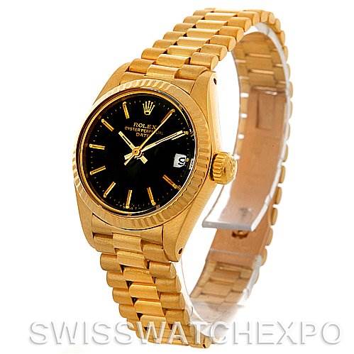 The image shows a Rolex President 6917 Women's Yellow Gold Black Dial 6917 Women's Yellow Gold Black Dial model watch from an angled front view, displaying the dial, bezel, crown, and bracelet.