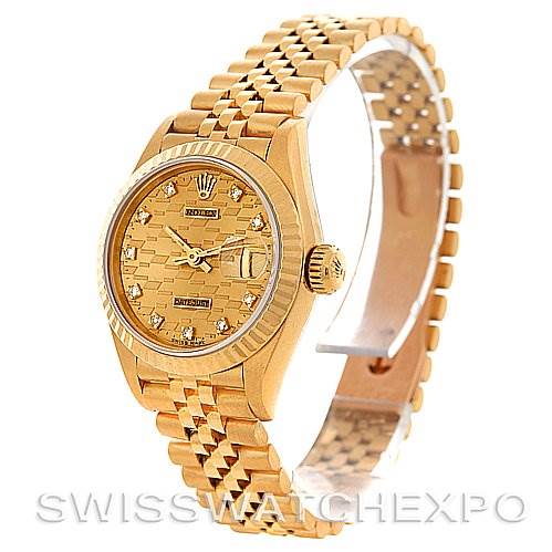 This image shows a side angle of the Rolex President 69178 Women's Yellow Gold Champagne Dial 69178 Women's Yellow Gold Champagne Dial model watch, highlighting its gold bracelet, bezel, and dial.