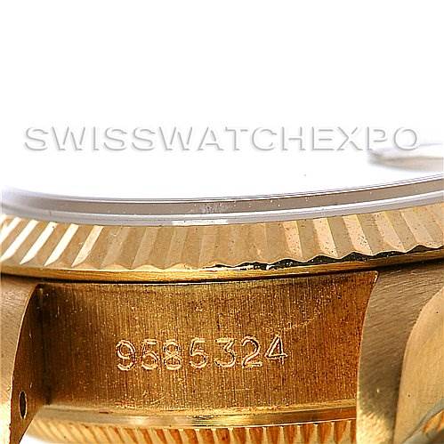 This image shows a close-up angle of a Rolex President 69178 Women's Yellow Gold Champagne Dial 69178 Women's Yellow Gold Champagne Dial model, focusing on the side of the case and part of the bezel with a serial number engraved.